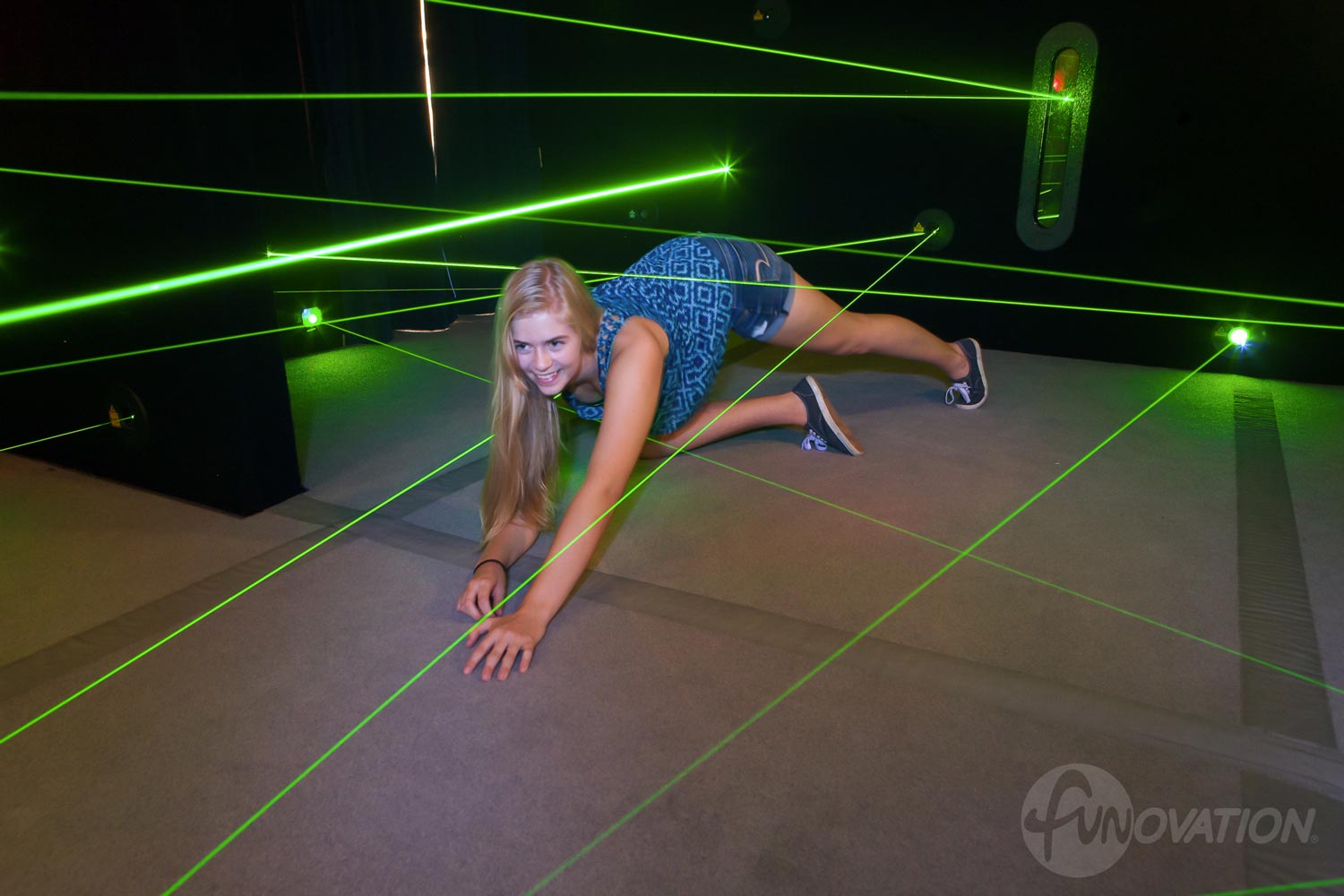 teen girl playing laser maze